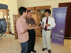 TV crews gave an interview how important the symposium was.